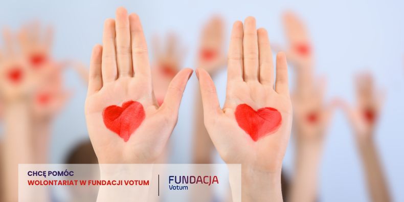 Outdoor charity table with Fundacja Votum materials: purple donation boxes, brochures, flyers, and a wicker basket of promo items on a white table.